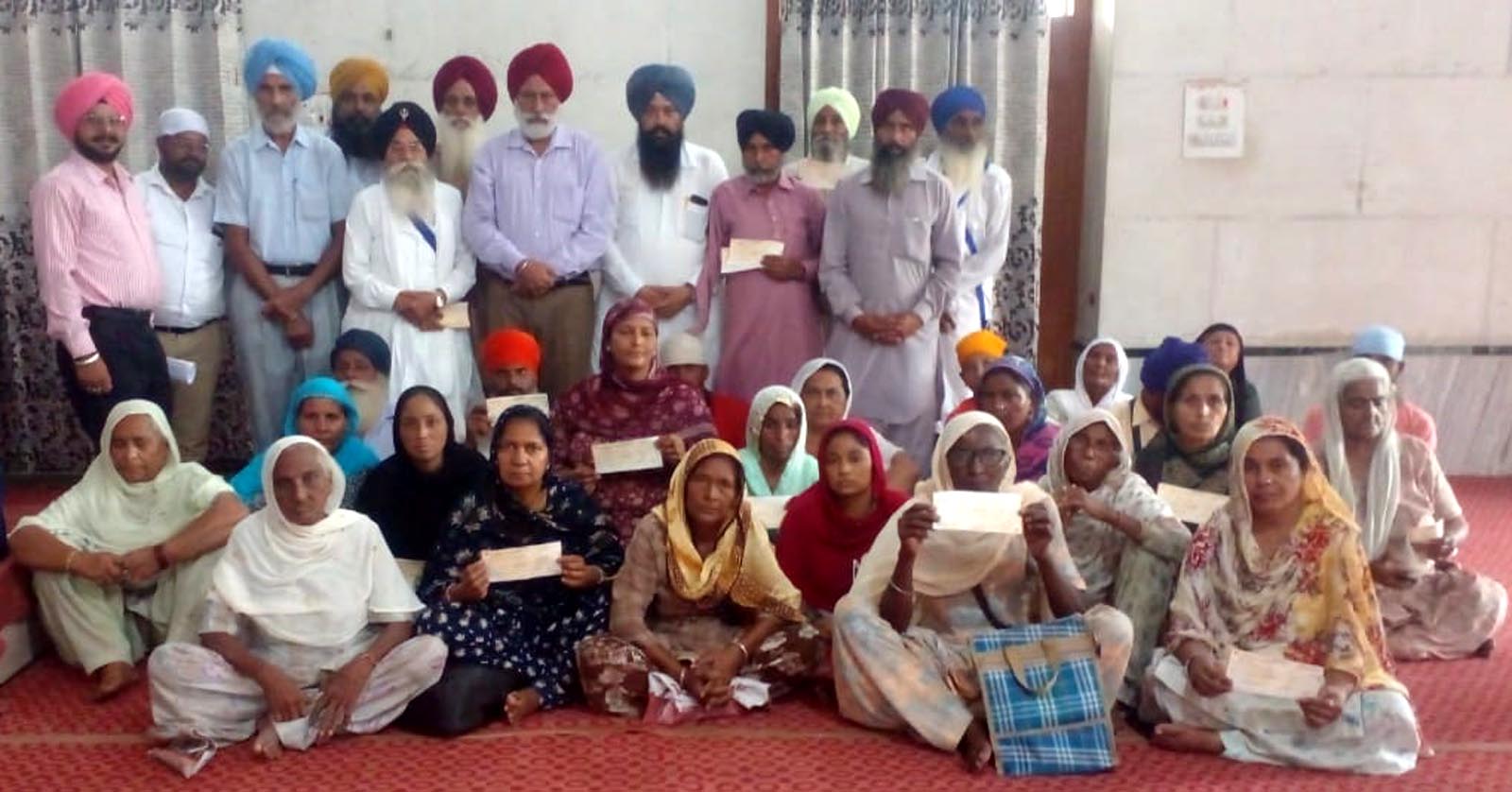 Sarbat da Bhala Charitable Trust distributes monthly pension checks to poor widows and disabled - Sidhu